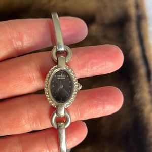 Citizen solar powered watch waterproof stainless steel black face, bezeled jewel